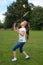 Little girl playing badminton outdoors