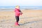 Little girl playing on the beach