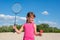 Little girl playing beach badminton. Family outdoor sports games. Active healthy lifestyle concept