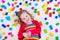 Little girl playing with colorful blocks