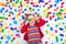 Little girl playing with colorful blocks