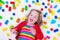 Little girl playing with colorful blocks