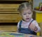 Little girl playing with counting sticks on the arithmetic