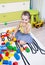 Little girl playing with cubes of plastic