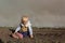 Little girl playing in the dirt