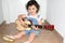 Little Girl playing guitar