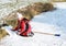 Little girl playing on iced pond