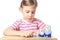 Little girl playing with matryoshka isolated