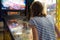 Little girl playing pinball game.