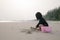 Little girl playing sandy on the beach