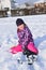 Little girl playing in the snow