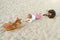 A little girl playing with stray dogs on the beach sand, abandoned animals in India, childlike spontaneity.