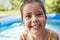 Little girl playing at swimmingpool