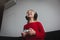 Little girl playing video games at home, child with remote control indoors