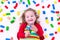 Little girl playing with wooden blocks