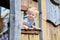 Little girl playing in wooden house in the park