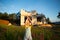 A little girl plays and dances near the construction site of her future house in the countryside. Waiting for a move, dreams of