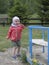 Little girl plays happy at the mountain playground