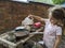 Little Girl Plays with a Mud kitchen