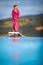 Little girl on a pool`s edge, learning to swim and dive.