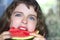 Little girl portrait eating watermelon slice
