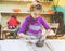 Little Girl At Pottery Workshop Working With Clay