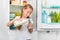 Little girl pouring milk in glass