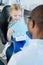 Little girl practicing correct teeth brushing in dentists office