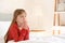 Little girl praying in bedroom