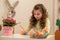 Little girl preparing for Easter - painting, drawing colored in the Room