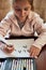 Little girl preschooler learning to write letters at home