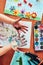 Little girl preschooler showing painted colourful hands