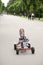 Little girl in racing car amusement park