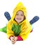 Little girl with raincoat playing on the ground