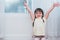 Little girl raise hands with happy gesture mood. Kids play and Back to school concept. Education and Portrait theme. People and