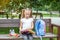 Little girl is reading books in the school park. The concept of school, study, education, friendship, childhood