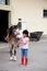 Little girl ready for a horseback riding lesson