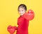 little girl with red boxing gloves on yellow background