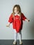 Little girl in red dress frighten photographer