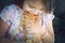 Little girl with a red kitten in hands close up. Bestfriends. I