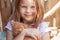 Little girl with a red kitten in hands close up. Bestfriends. I