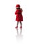 Little girl in red santa hat holds teddy bear toy on white background