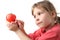 Little girl in red shirt holding kitchen timer