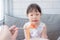 Little girl refuse to eat tomato in spagethi from her mother