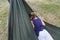 little girl relax on hammock in forest