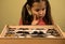 Little Girl Researching Entomology Collection of Tropical Butterflies