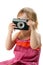 Little girl with retro camera