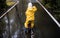 Little girl ride on bike in a rainy day