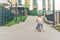 Little girl riding balance bike in the courtyard of the residence in Prague, Europe