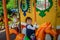 Little girl riding on a carousel sitting on horseback